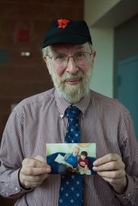 Professor Malkevitch with photo of grandson wearing York t-shirt
