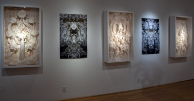 Multiple art pieces by Pablo Garcia Lopez in the York College gallery space including sculptures, painting and on-screen