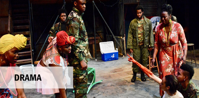 Scene from Ruined by Lynn Nottage with bloodied woman pointing up at soldier.