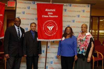 Alums posing with their 25th class Reunion banner