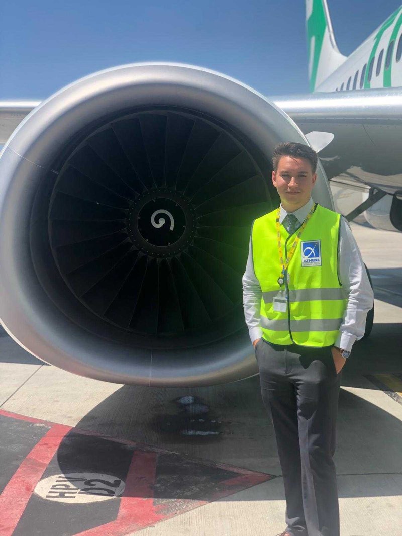 Vitaliy Matsko stands in front of airplane