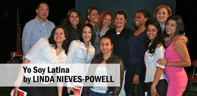 Students stand with playwright Linda Nieves-Powell.
