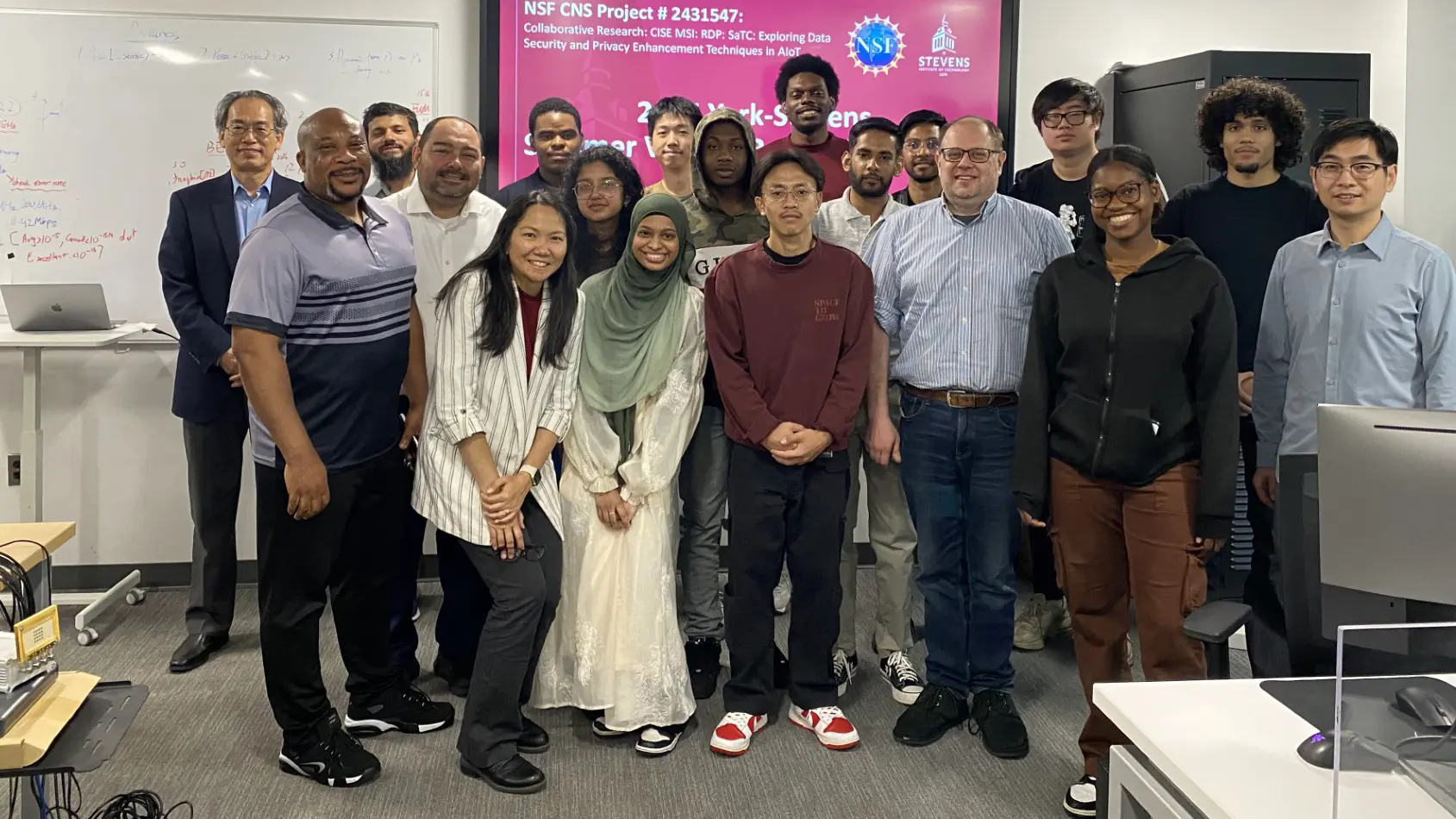 Students, faculty and staff pose at SIT.