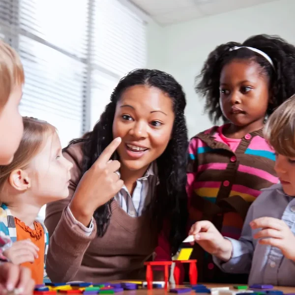 Teacher Engaging with Preschool Students